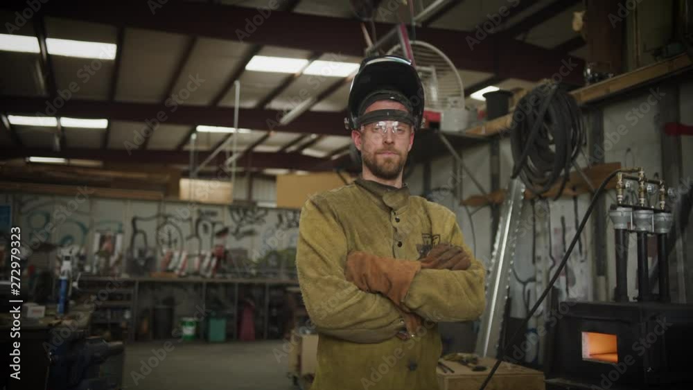 Metal worker with propane forge burner slow motion wide Metal worker with propane forge burner slow motion wide