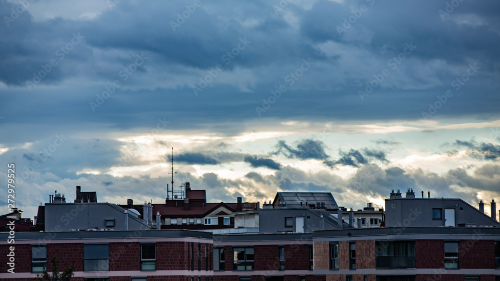 Rainy clouds travel over apartments buildings Rainy clouds travel over apartments buildings