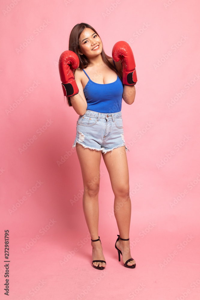 Full body of beautiful young asian woman with red boxing glove Full body of beautiful young asian woman with red boxing glove