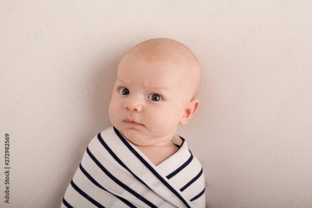 Portrait of a two-month boy on a bed with a diaper Portrait of a two-month boy on a bed with a diaper