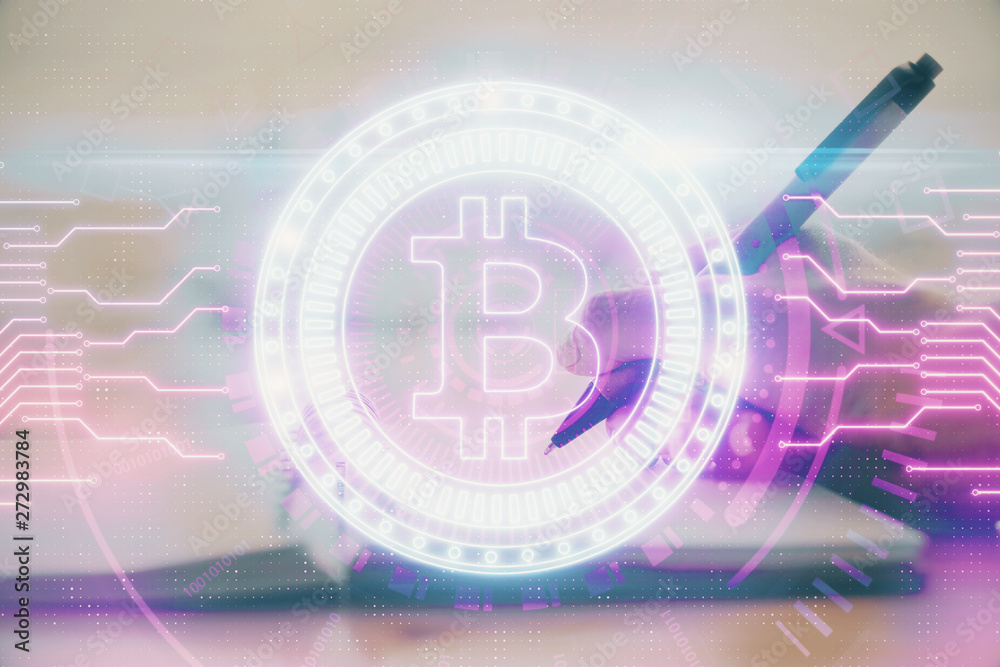 Cryptocurrency hologram over hands taking notes background. Concept of blockchain. Multi exposure Cryptocurrency hologram over hands taking notes background. Concept of blockchain. Multi exposure