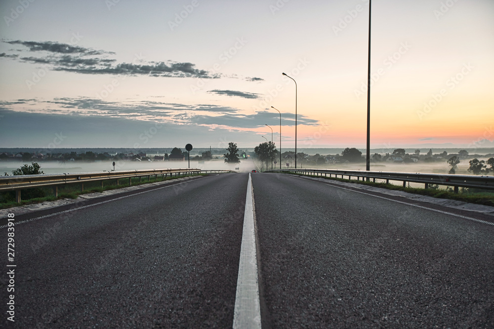 Evening road landscape, great design for any purposes. Nature background. Night landscape. Dramatic nature background.