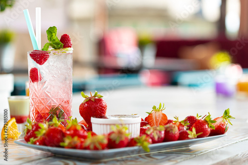 Raspberry Mojito Lemonade with lime and fresh mint in glass