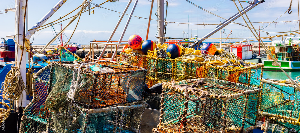 Crayfish nets and traps on a small fishing boat Stock Photo