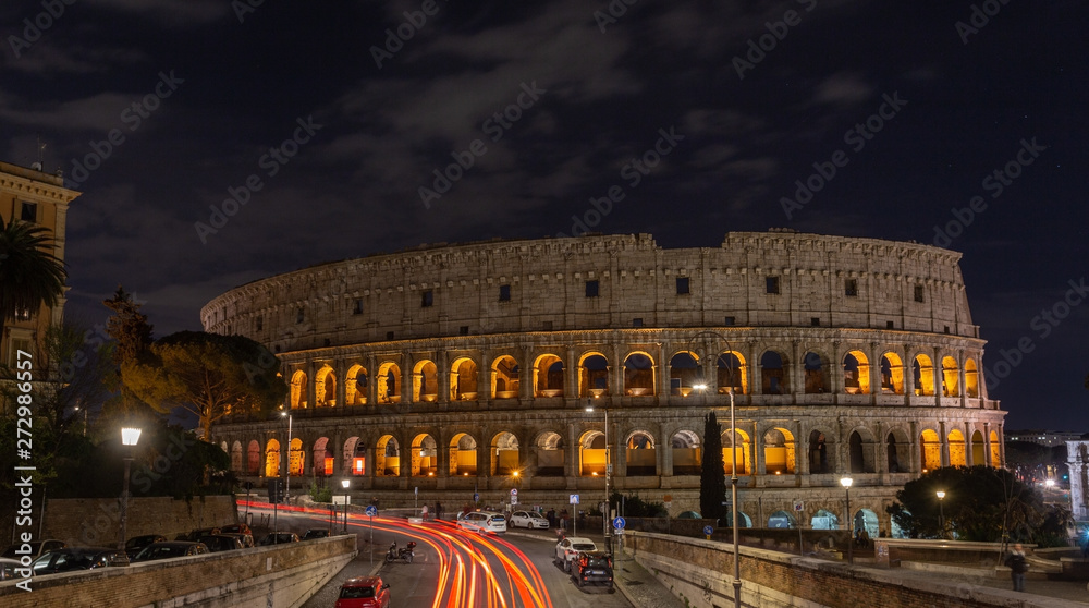 Italian monument to the Colosseum in the center of Rome in the illuminated night.