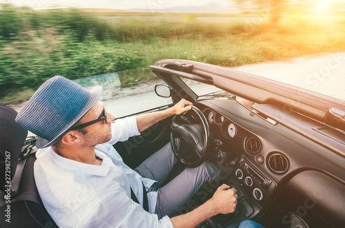 Happy Man driving cabriolet car by province mountain road top view imaage photo