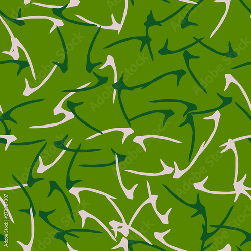 Forest camouflage of various shades of green and beige colors