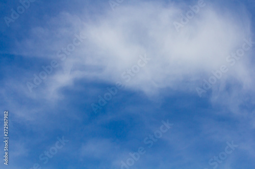 White clouds with blue sky background.