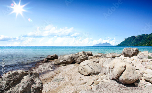 Summer background of beach and ocean and blue skyh. Sunny hot day © magdal3na