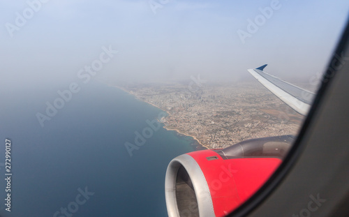 View of the Mediterranean Sea and the coast of Tel Aviv city from the window of a flying airplane, Tel Aviv in Israel