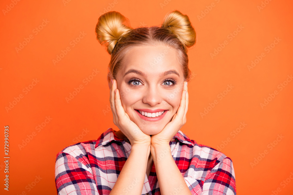 Portrait of charming lovely youth touch cheeks hands palms fingers feel glad nice content dressed checked plaid shirt fashionable clothing isolated orange background Portrait of charming lovely youth touch cheeks hands palms fingers feel glad nice content dressed checked plaid shirt fashionable clothing isolated orange background