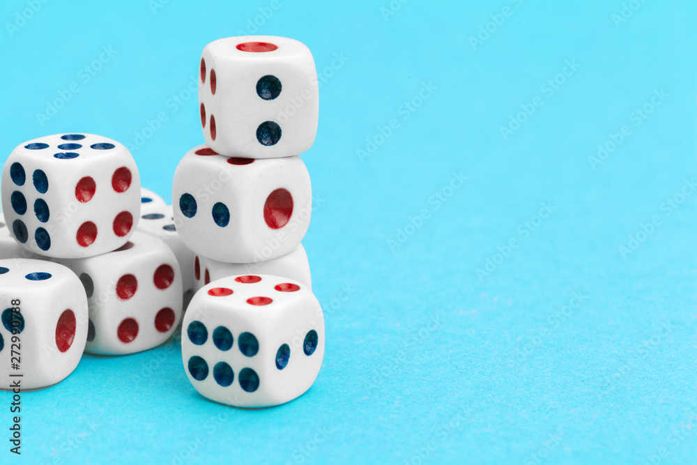 Gaming dices on blue background. Game concept. Gaming dices on blue background. Game concept.