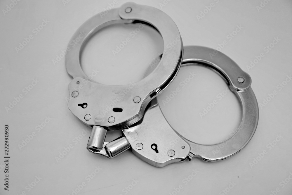 handcuffs on black background handcuffs on black background