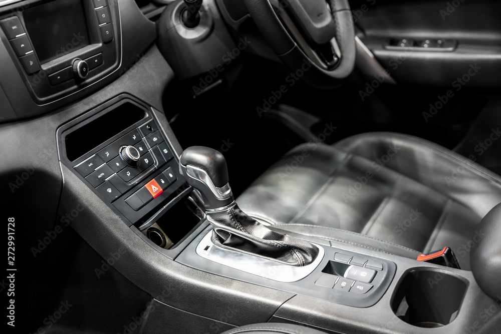 Gear Lever or Shift Lever with cup holder and air condition control in modern car.