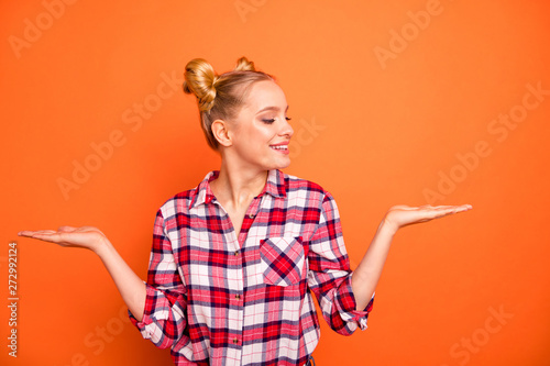 Close up photo nice she her lady perfect appearance hold open hands arms palms products look better one advising buy buyer wear casual checkered plaid pink shirt isolated bright orange background