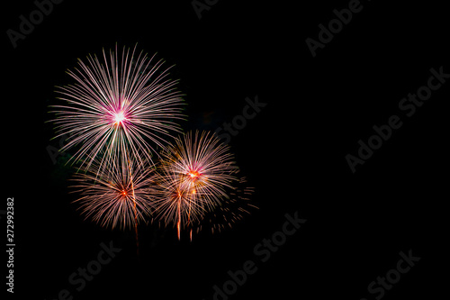 Beautiful colorful fireworks display on the sea beach, Amazing holiday fireworks party or any celebration event in the dark sky.