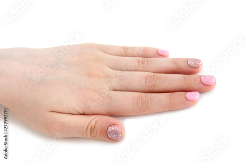 women's brush with a beautiful manicure on white background