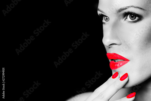 face of a stylish girl with big lips close up and manicure