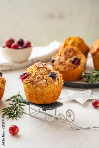 Christmas homemade cranberry muffins. Christmas cake on New Year's background. Copy space.