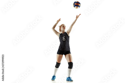 Young female volleyball player isolated on white studio background. Woman in sport's equipment and shoes or sneakers training and practicing. Concept of sport, healthy lifestyle, motion and movement. © master1305
