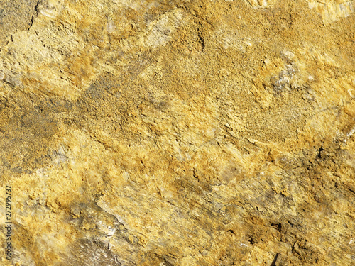 Brown background of a large piece of rock with texture detail