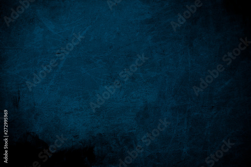 Dark blue ripped wall, grungy background or texture