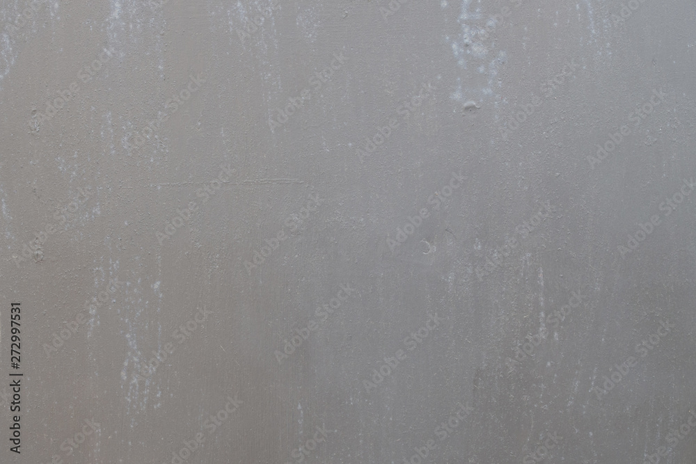 background of painted gray metal with slight smudges of rust