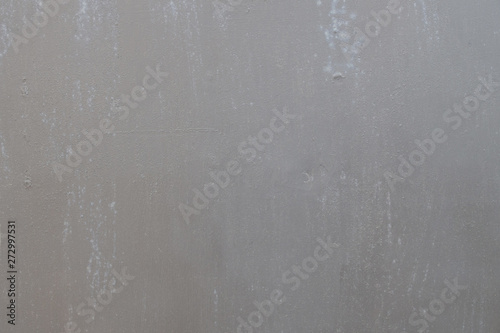 background of painted gray metal with slight smudges of rust