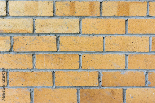 old yellow brick wall background