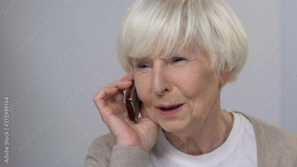 Smiling senior woman talking phone, family care, happy relationship, close-up Smiling senior woman talking phone, family care, happy relationship, close-up