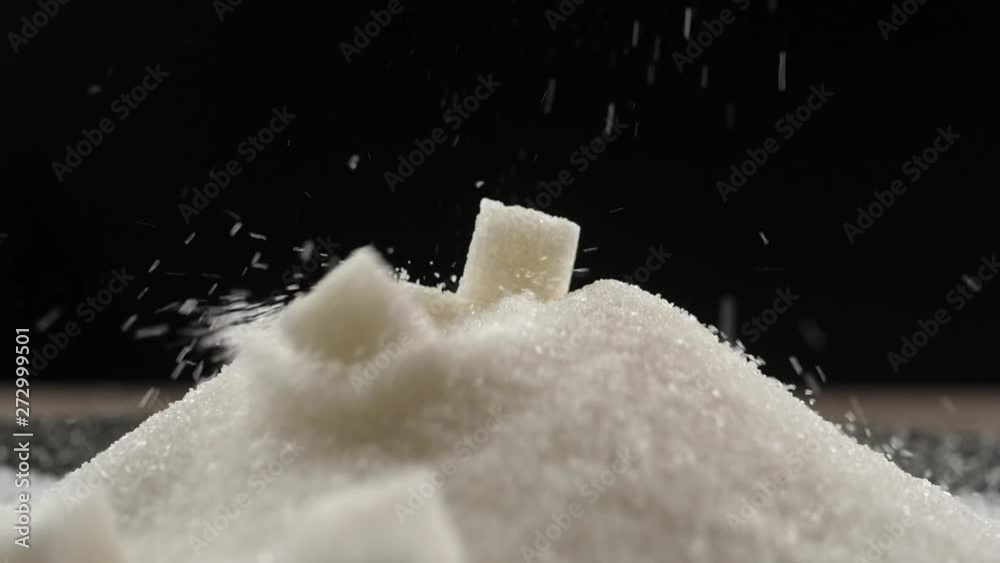 sugar cubes fall on a pile of sugar sugar cubes fall on a pile of sugar