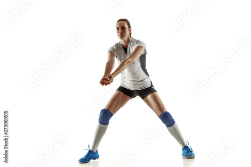 Young female volleyball player isolated on white studio background. Woman in sport's equipment and shoes or sneakers training and practicing. Concept of sport, healthy lifestyle, motion and movement. © master1305