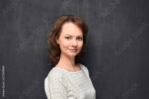 Portrait of cute girl smiling slightly © Andrei Korzhyts
