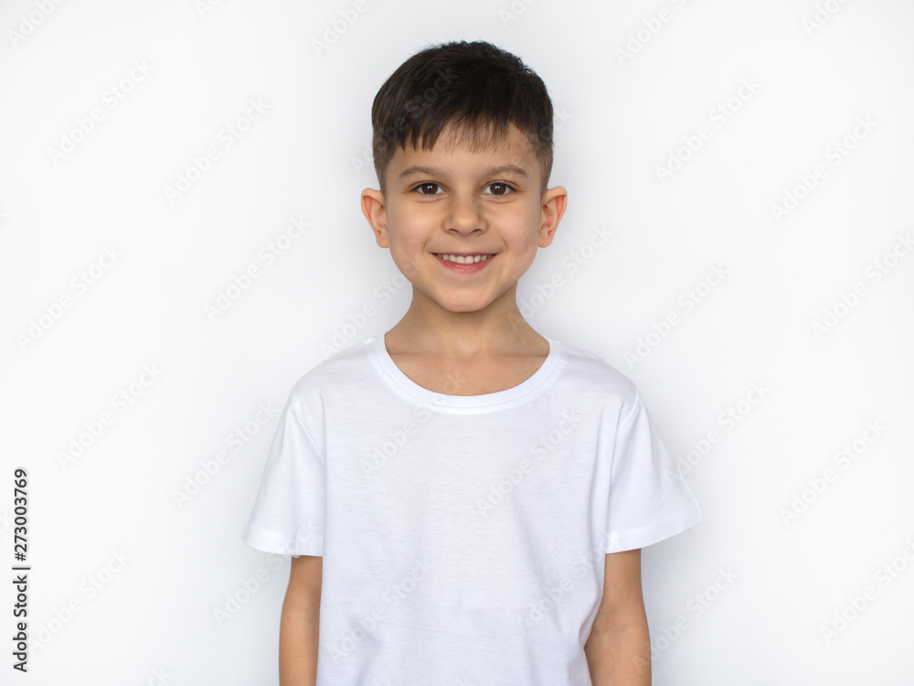 little smiling boy in white t-shirt isolated on white, t shirt design concept little smiling boy in white t-shirt isolated on white, t shirt design concept