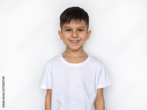 little smiling boy in white t-shirt isolated on white, t shirt design concept