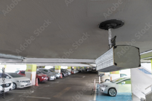 CCTV security camera in parking lot security cars. Security Concept.