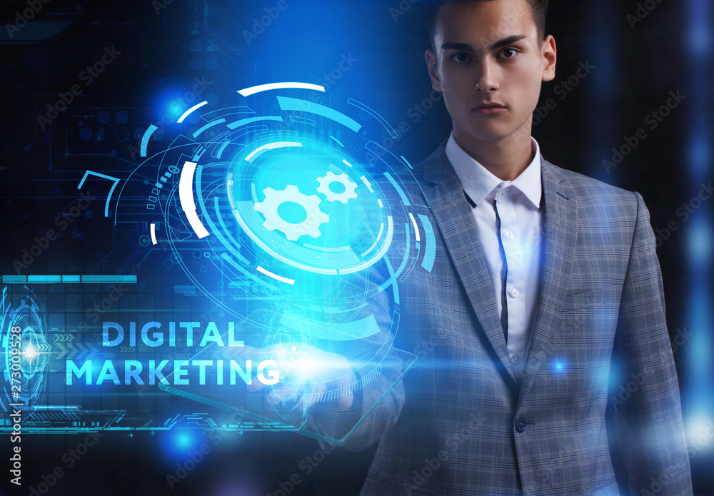 The concept of business, technology, the Internet and the network. A young entrepreneur working on a virtual screen of the future and sees the inscription: Digital Marketing The concept of business, technology, the Internet and the network. A young entrepreneur working on a virtual screen of the future and sees the inscription: Digital Marketing