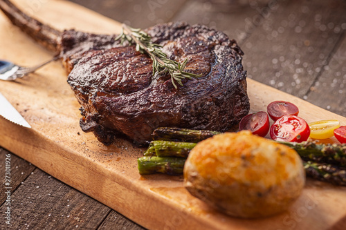 Bone-in Tomahawk Ribeye Steak meal angled