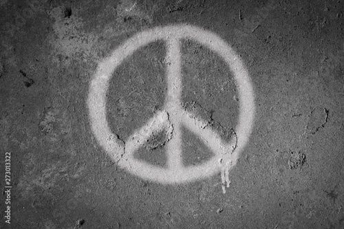 Peace symbol spray painted on the wall