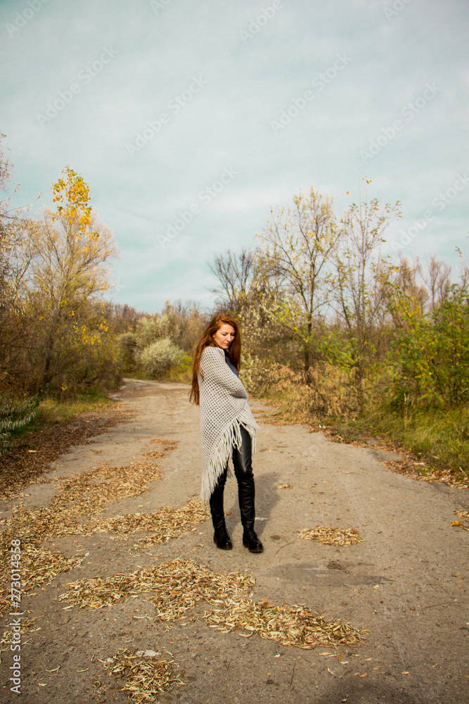 young redhead woman with scarf in autumn park young redhead woman with scarf in autumn park