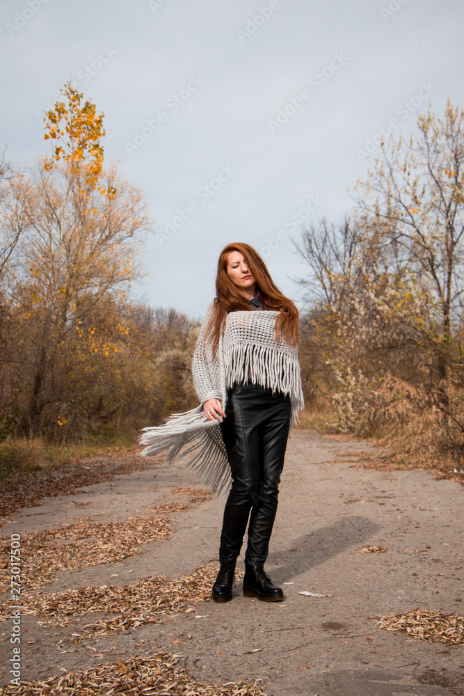 Young redhead woman with scarf in autumn park Young redhead woman with scarf in autumn park
