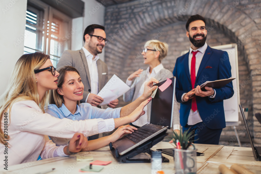 Group of business people working in office and discussing new ideas