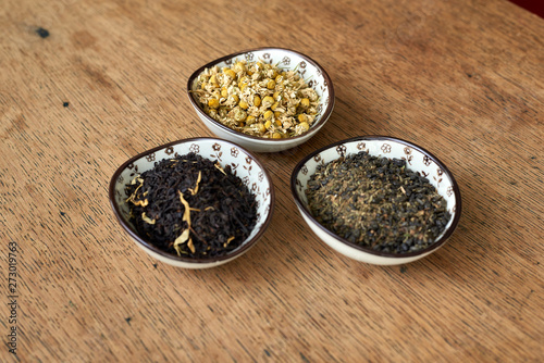 Earl Grey and Chamomile tea on a wooden table 