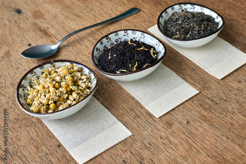 Earl Grey and Chamomile tea on a wooden table 