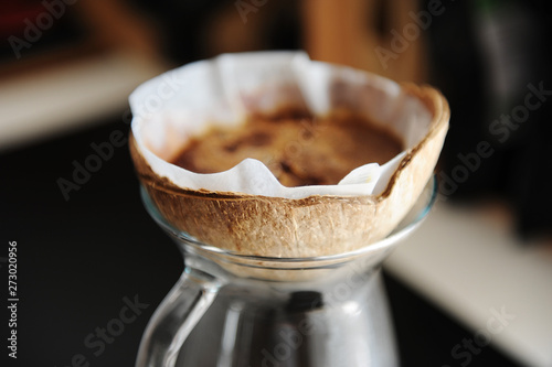 Unusual creative coconut shell pourover drip alternative coffee brewing close up