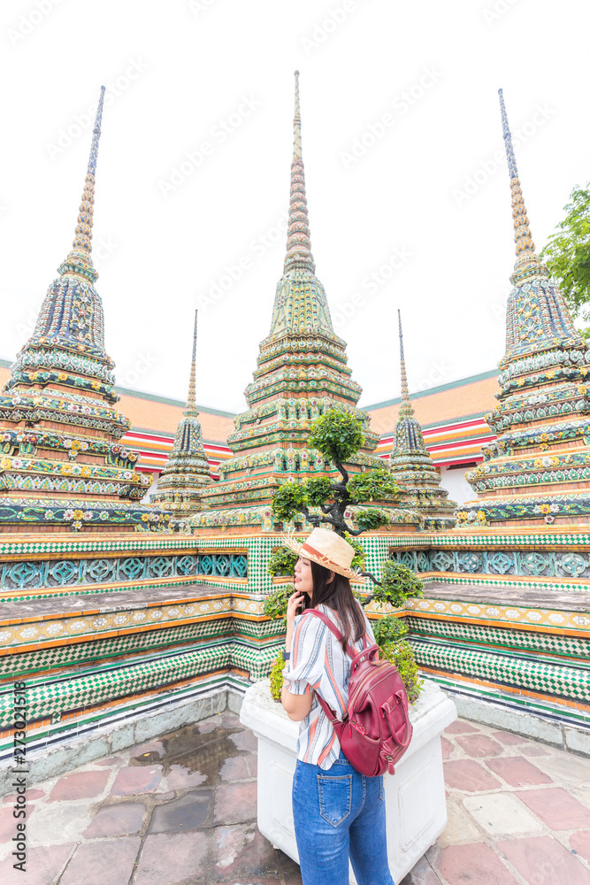 Beautiful asian tourist backpack women travel in buddhist temple sightseeing of Bangkok