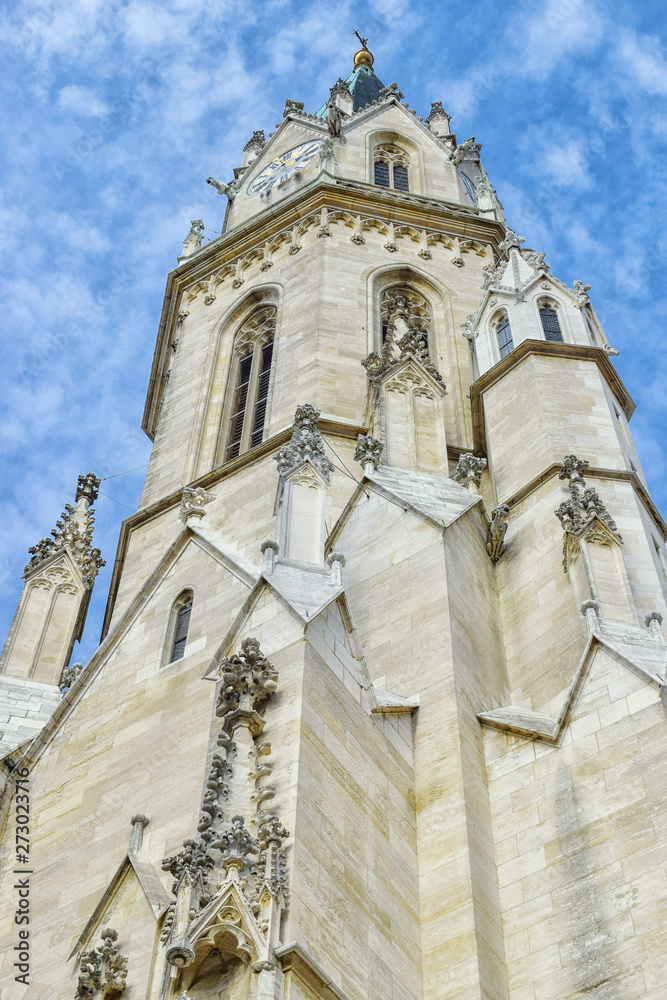 Bottom view to catholic church with cloudy sky in Vienna Austria