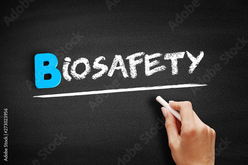 Biosafety text on blackboard, medical concept background