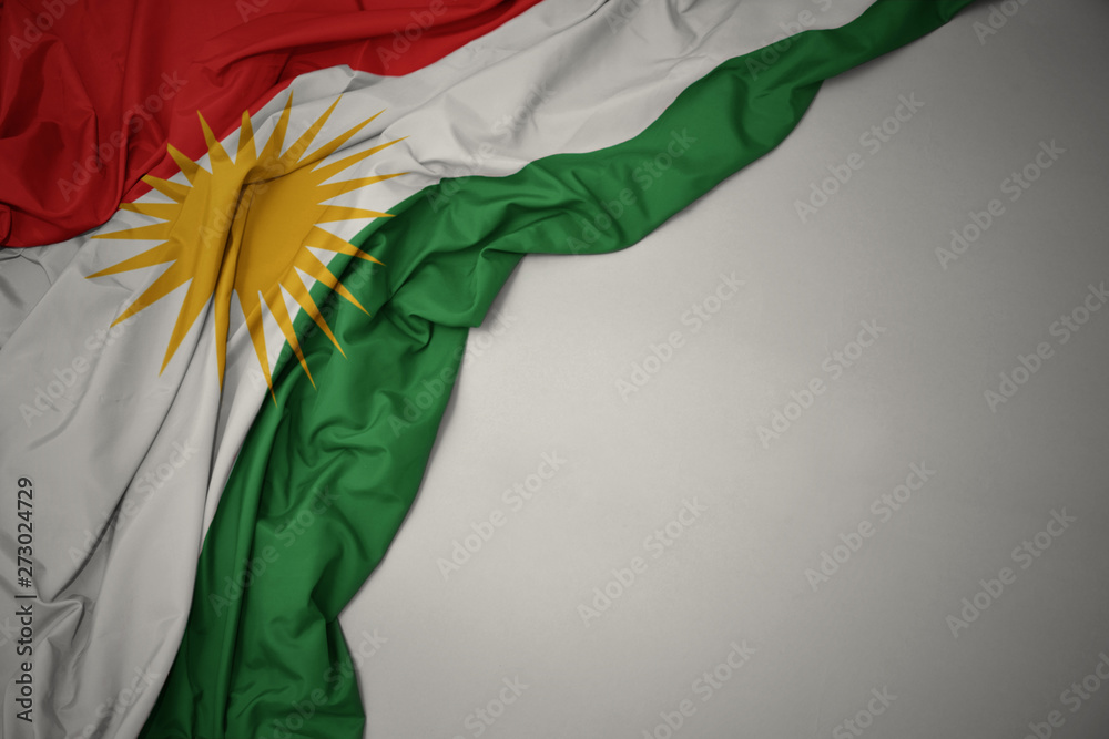 Ταπετσαρία waving national flag of kurdistan on a gray background.