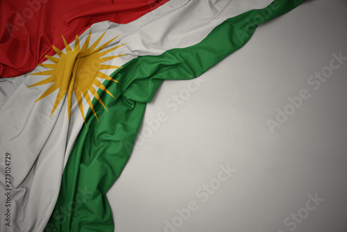 Tablou pe pânză waving national flag of kurdistan on a gray background.